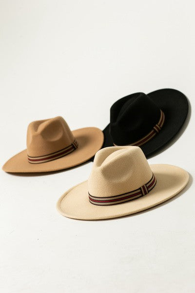 Designer-Inspired Trim Fedora Hat by JOSSLYN in Black, Ivory, and Tan Canvas — styled on wood surface