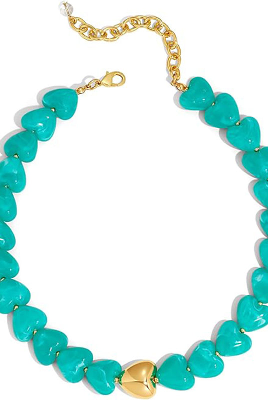 A heart-shaped beaded necklace with turquoise-colored stones and gold-tone metal accents, including a central gold heart and chain clasp, shown on a plain white background.