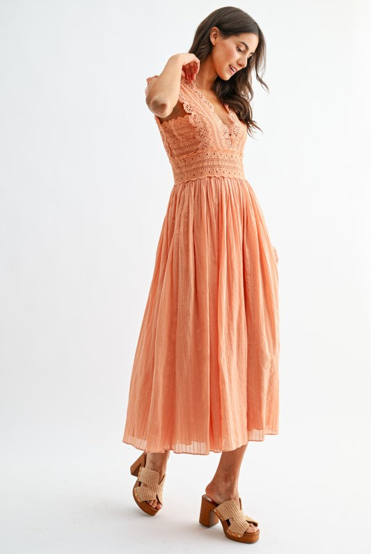 Orange lace boho midi dress, close-up of open V-back with tie detail