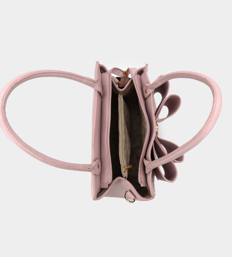 Pink butterfly-shaped handbag on a light gray background
