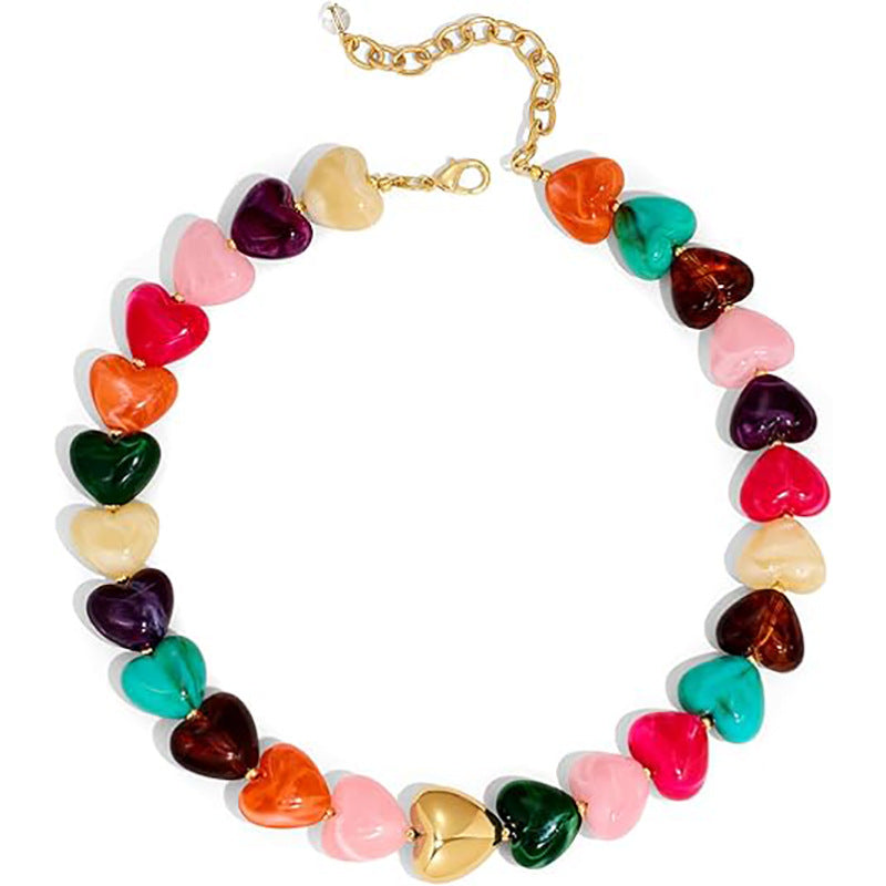 Colorful heart-shaped bead necklace on a white background